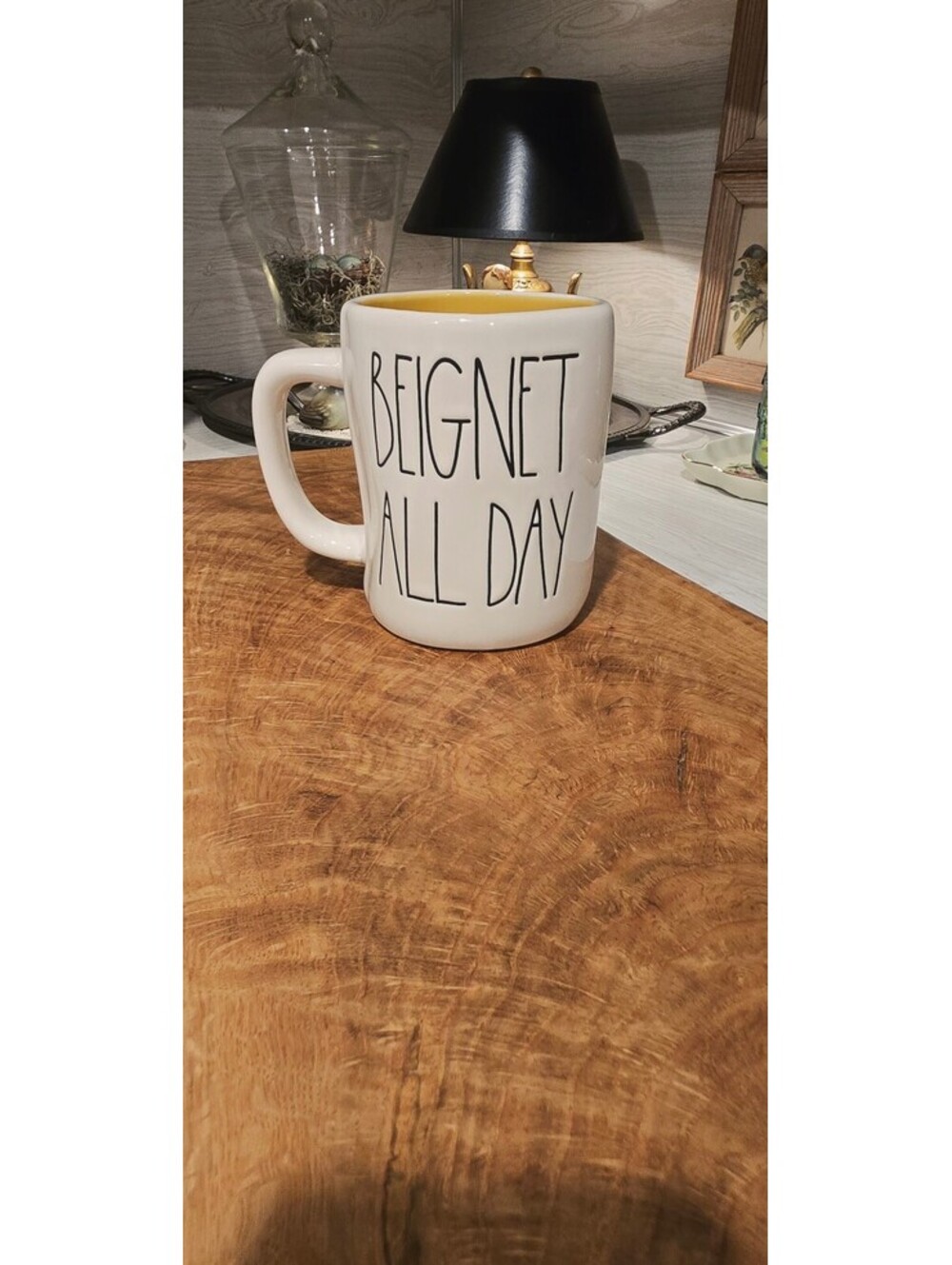 Ceramic mug titled 'Beignet All Day' by Rae Dunn